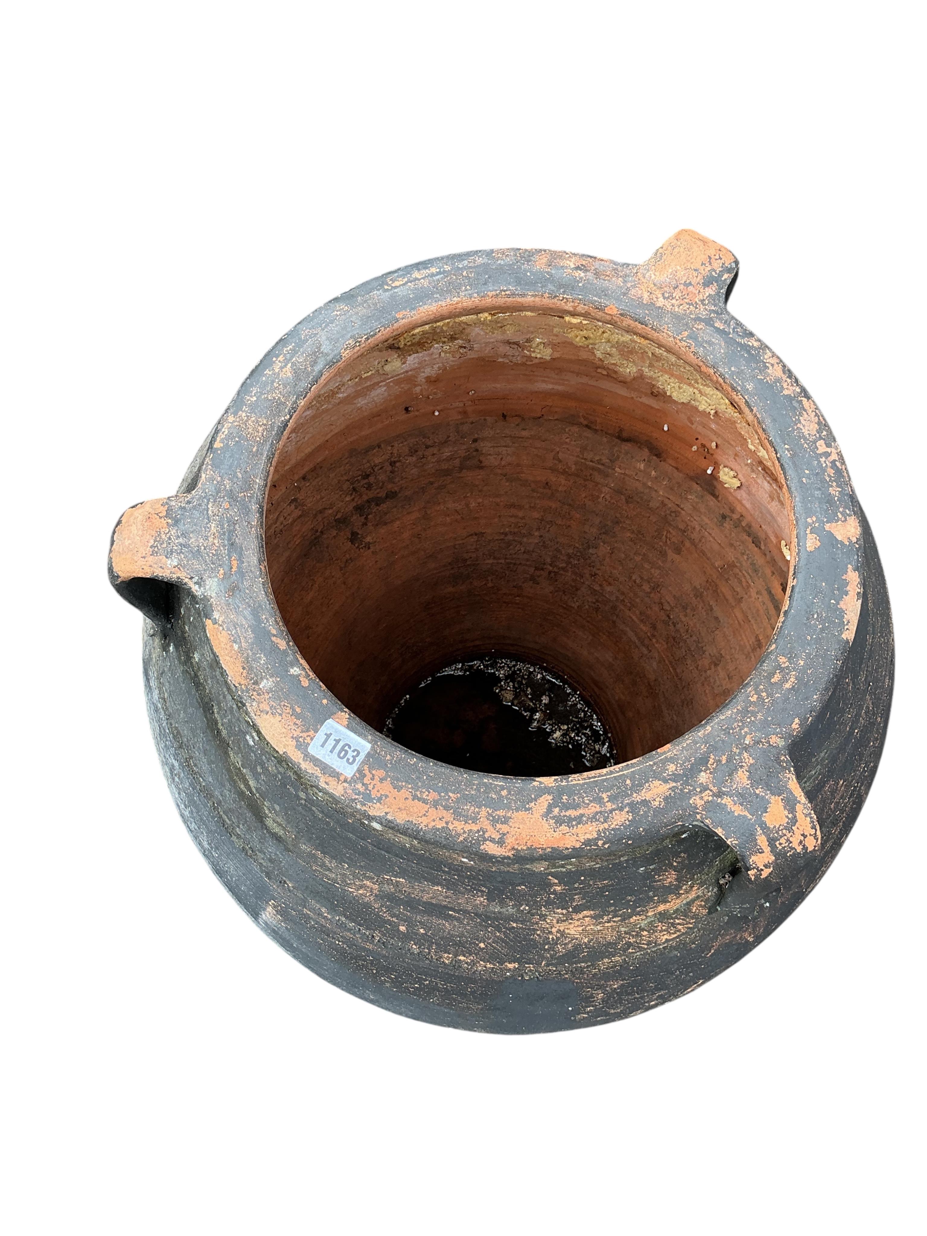 A Greek style painted terracotta oil jar, height 84cm